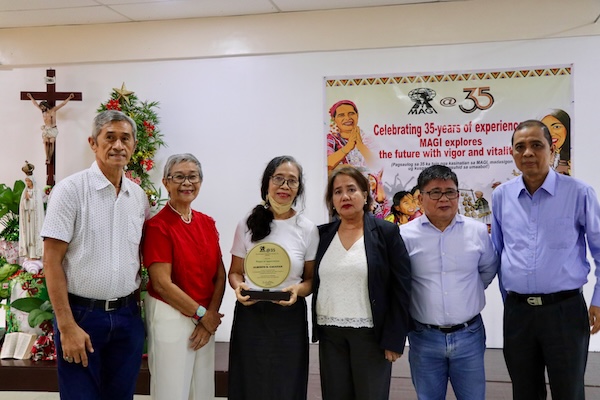 MAGI Board of Trustees with Agned Miclat Cacayan holding a plaque of recognition